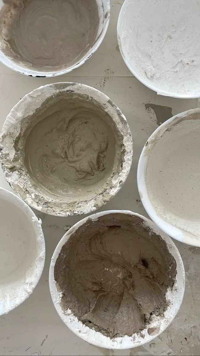 Buckets of mixed plaster and drywall compound